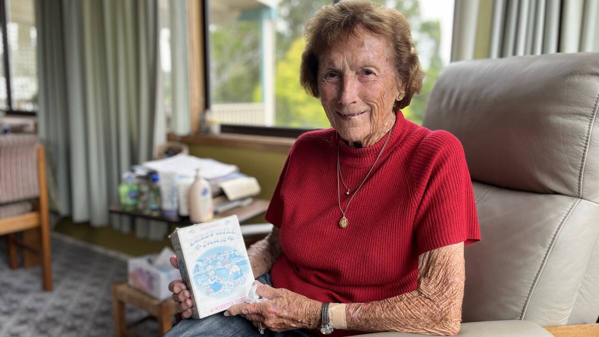Gwen holds a book called 'Daisy Hill Farm' which sat on a nearby table, her face beamed when she opened it up to listen to the stories printed inside. Picture by James Parker