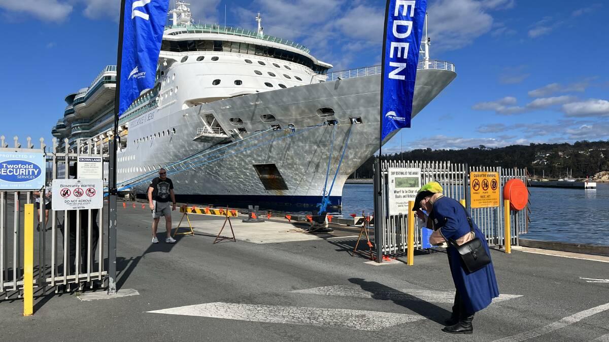 Bega Valley Shire Town Crier Alan Moyse welcomes passengers departing a cruise ship. Picture by James Parker