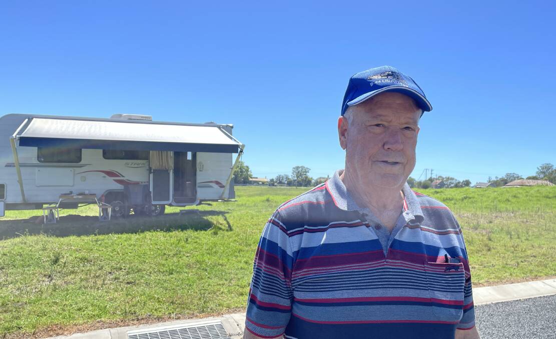 Gavin Law parked his caravan, which he has been living in since 2021, on his block in Wolumla to highlight the delays experienced in getting his new home. Picture by Denise Dion