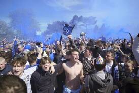 Ipswich Town supporters are celebrating after their side's return to English football's top flight. (AP PHOTO)