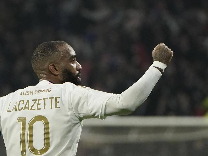 Alexandre Lacazette scored one of Lyon's goals in the 2-1 win over Metz in the French league. (AP PHOTO)