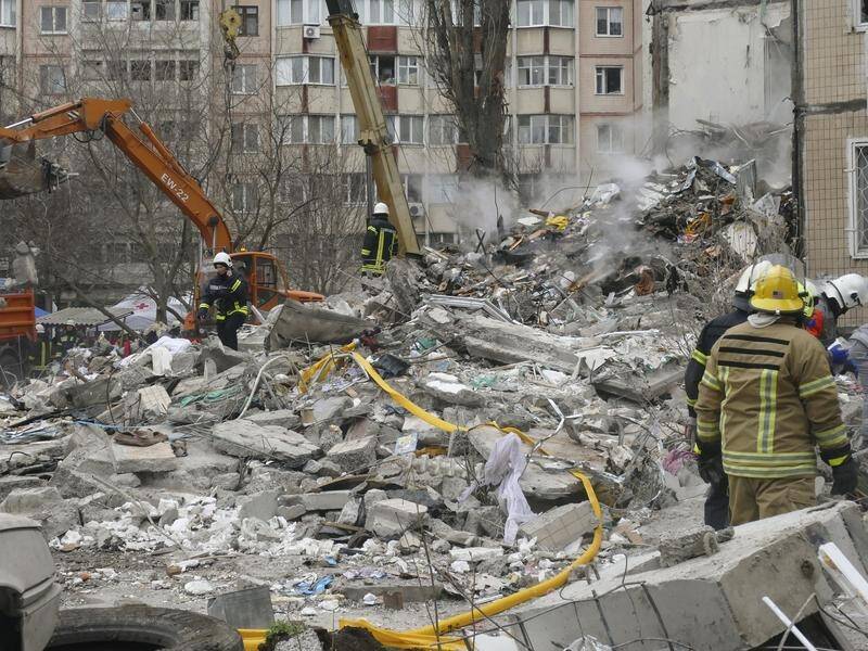 Rescuers work at the site of a residential building in Odesa damaged during a Russian drone attack. (EPA PHOTO)