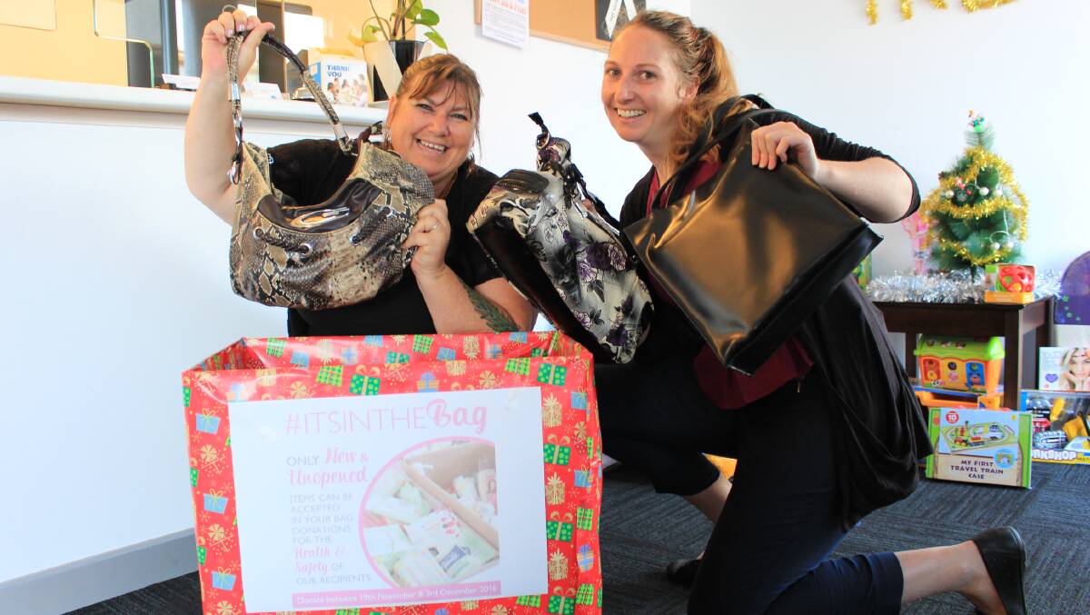DONATION: Merimbula News Weekly staff Sandra Irving and Melanie Leach show off some of the bags already donated to the office's Share the Dignity collection box. 