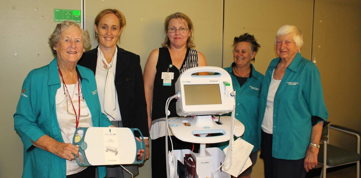 Pambula Hospital: Auxiliary's Barbara Davy, Lynn Ashton and Win Rowland, Emily Dearing and Sue Berry with the new falls prevention machine.